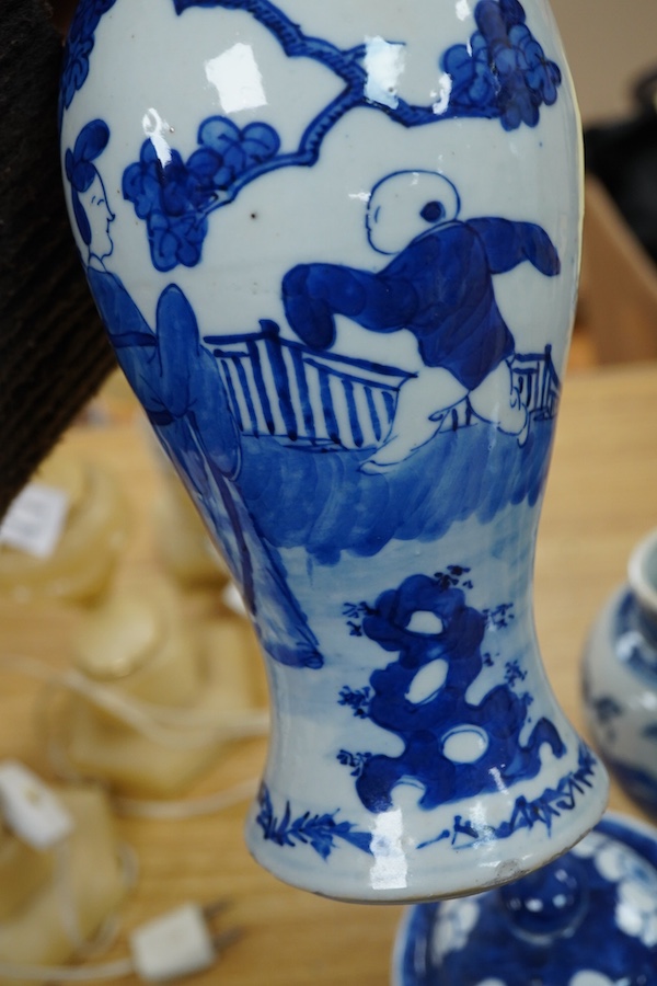 A pair of Chinese blue and white vases and a baluster jar and cover, largest 23cm high